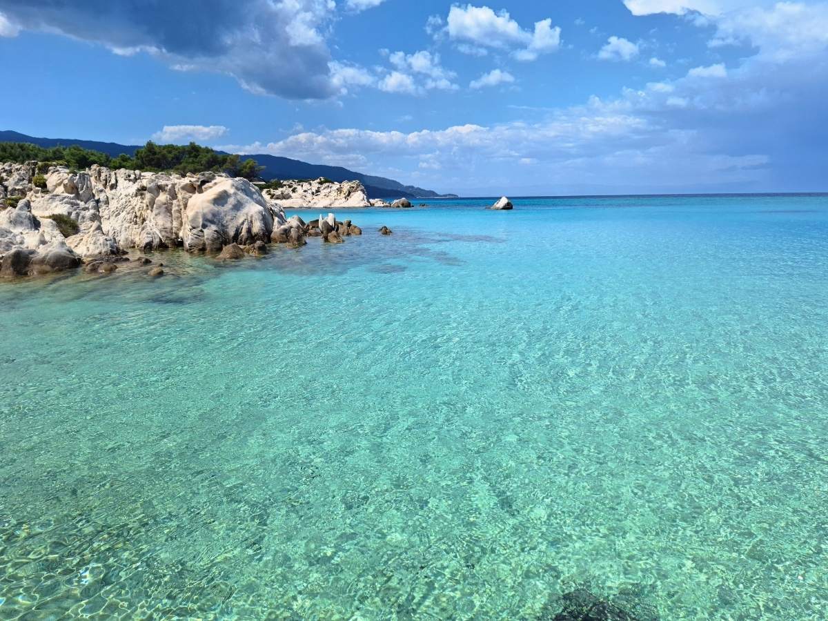 Orange Beach Sithonia with clear turquoise water and scenic white rock formations