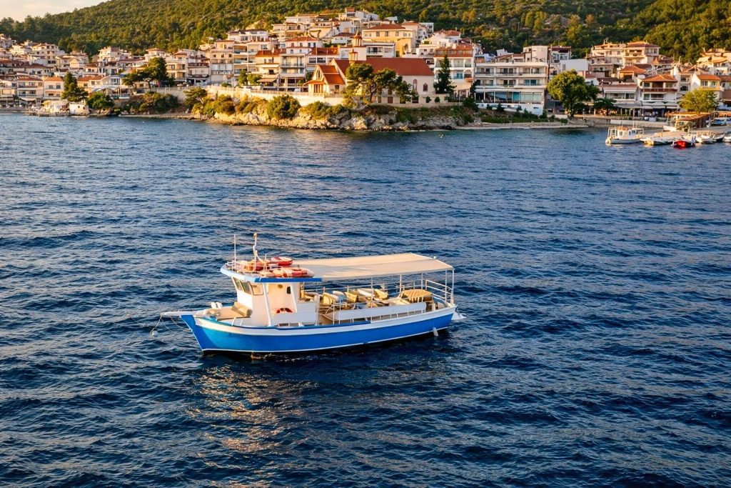 Small boat departing from Neos Marmaras marina for Sunset Toroneos Cruise