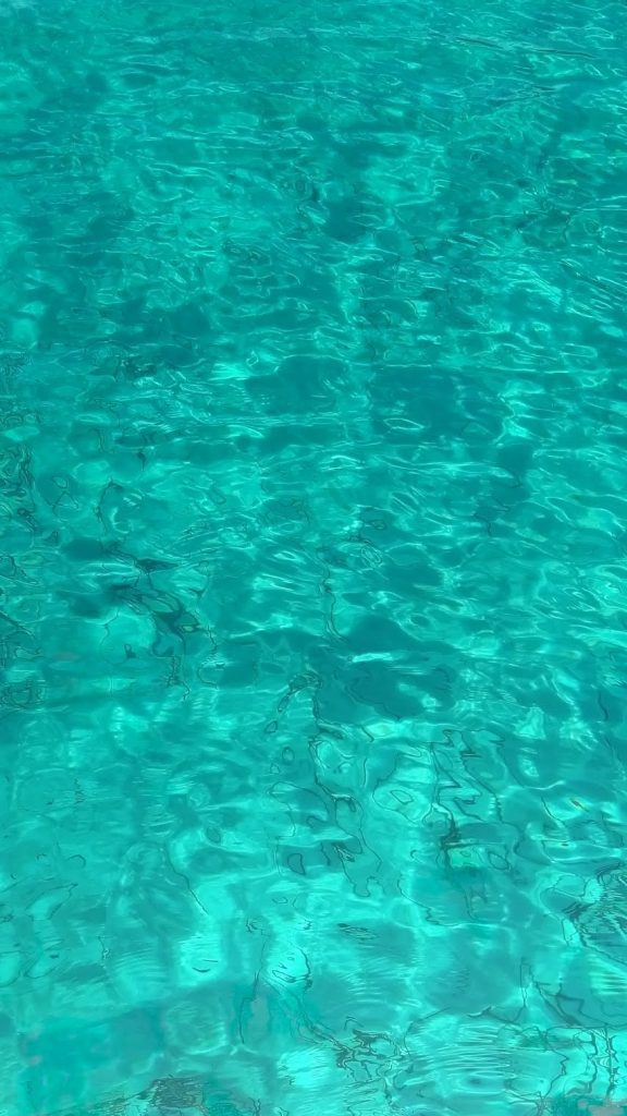 Crystal clear turquoise water at Blue Lagoon near Diaporos Island in Sithonia Greece